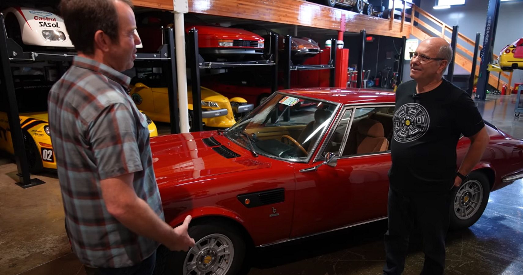 Colin Comer (left) talks about the 1972 Fiat Dino with owner Sammy