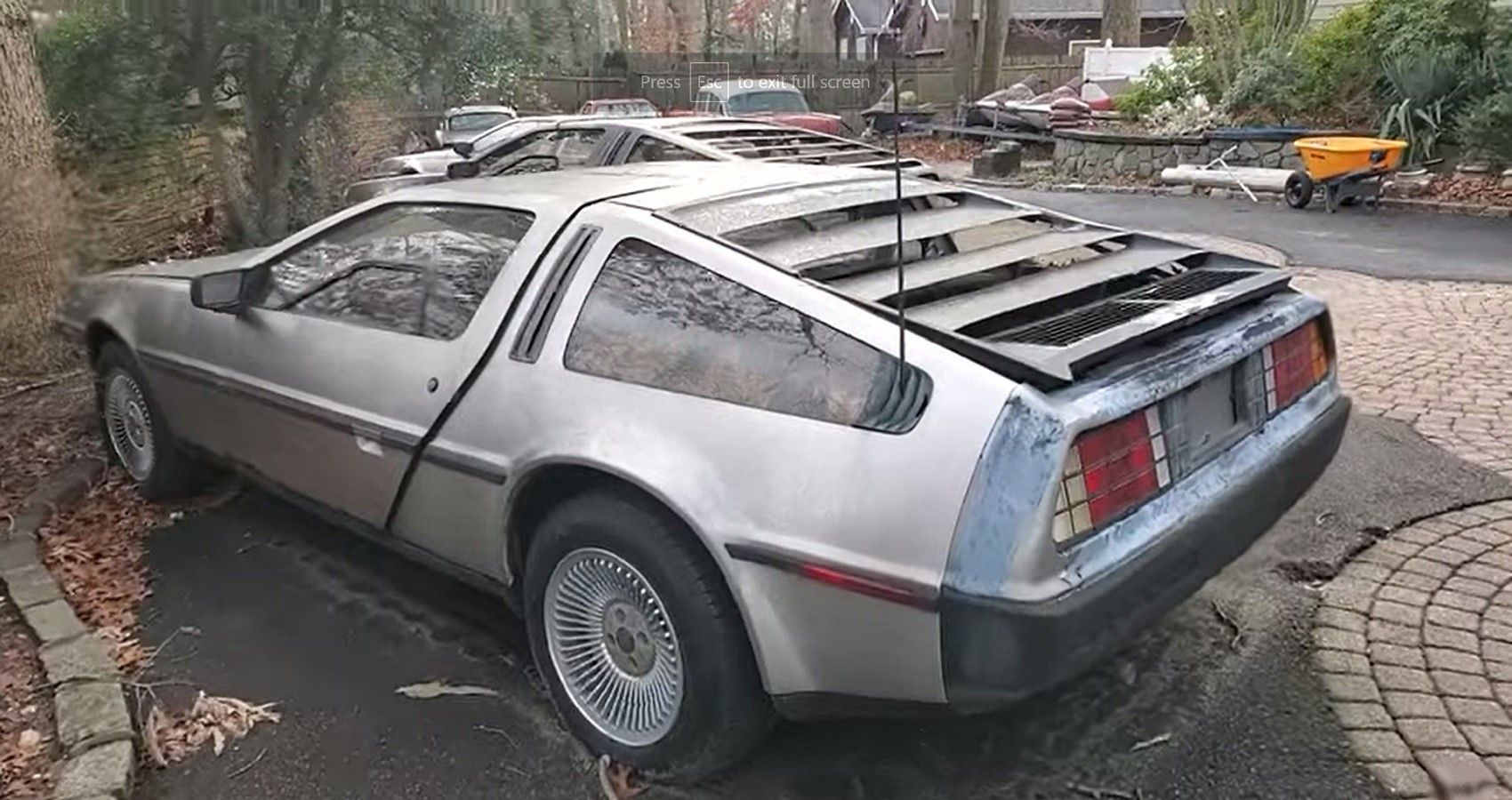 DeLorean DMC-12 and car collection, outside in lot