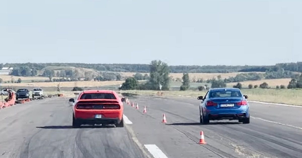 Red Dodge Challenger Hellcat and Estoril Blue BMW 440i xDrive drag race
