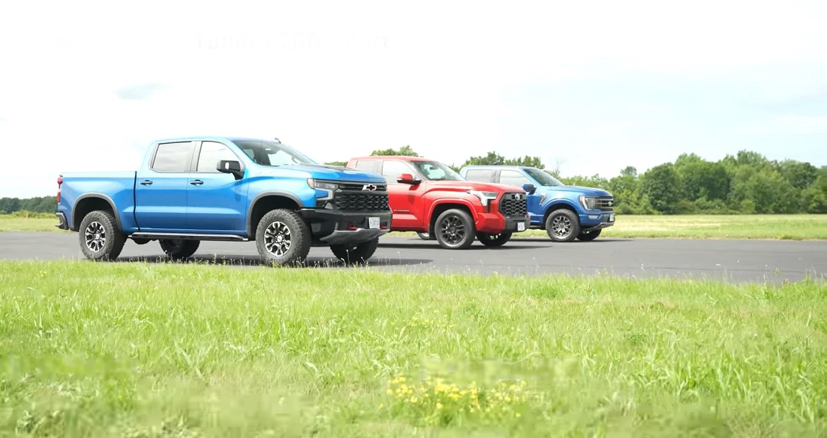 Ford F-150 Chevrolet Silverado, Toyota Tundra drag race, front quarter view of all in a line
