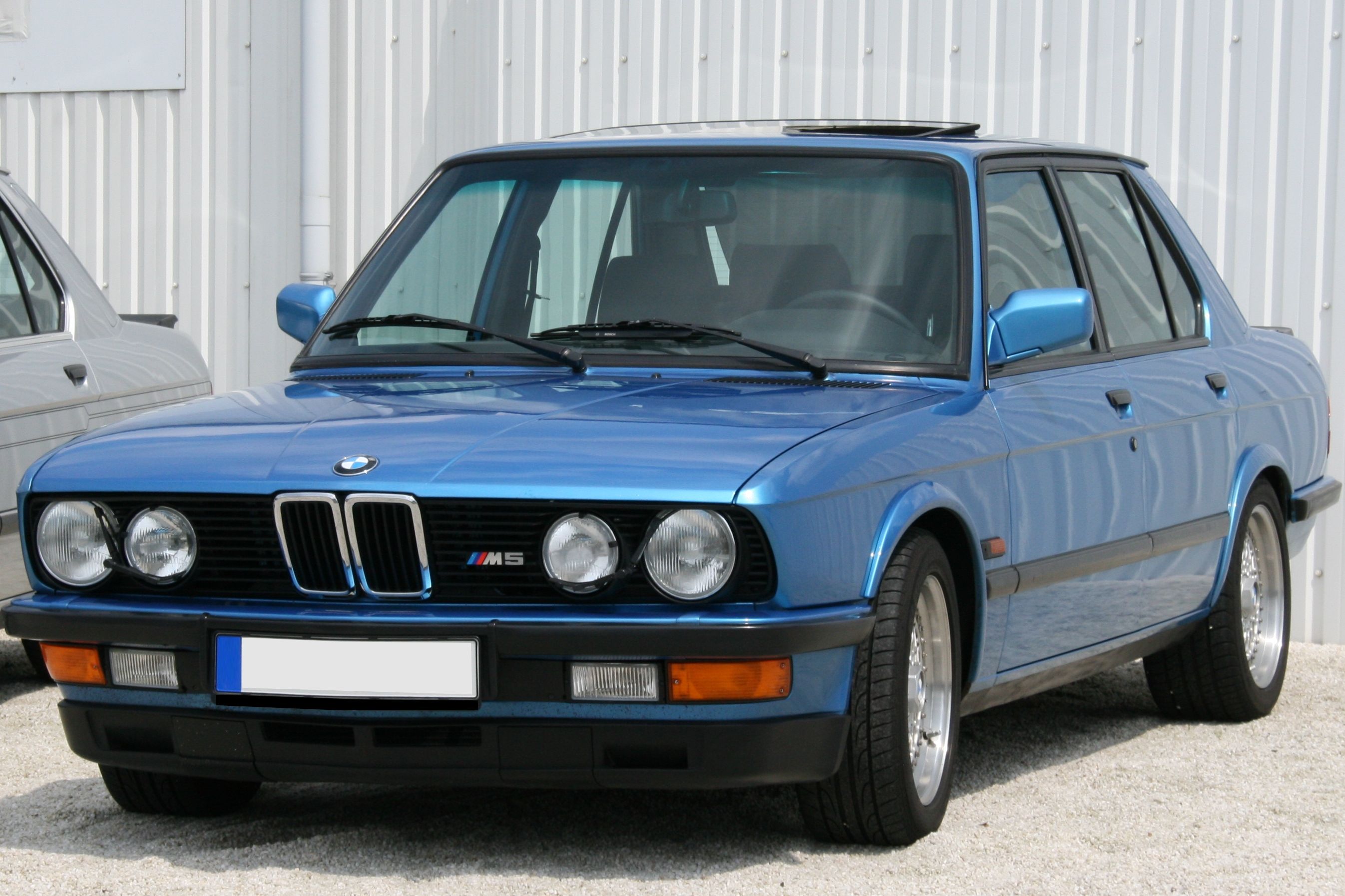 Blue BMW M5 E28 parked at show