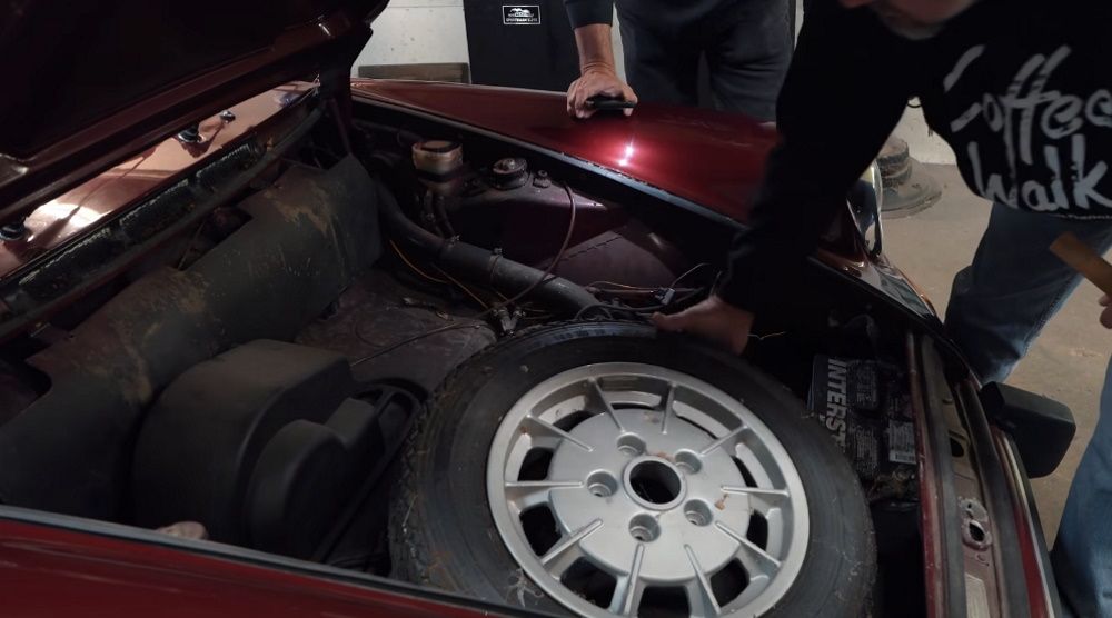 Inspecting the rare wheels with the 1973 Porsche 911T, view into frunk
