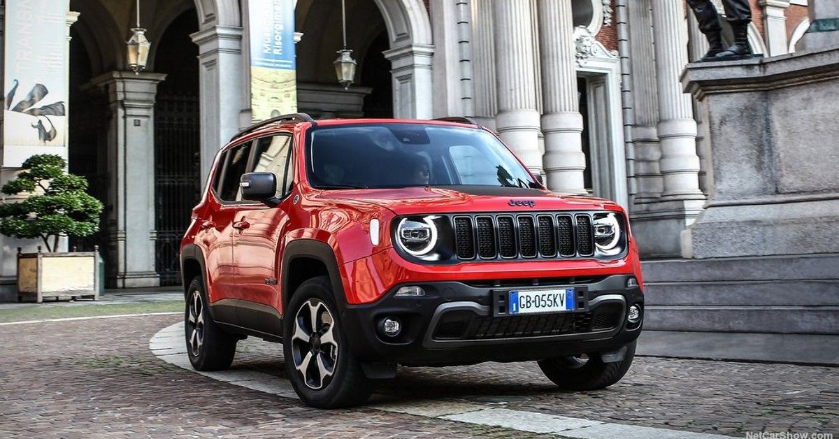 Red Jeep Renegade SUV parked.