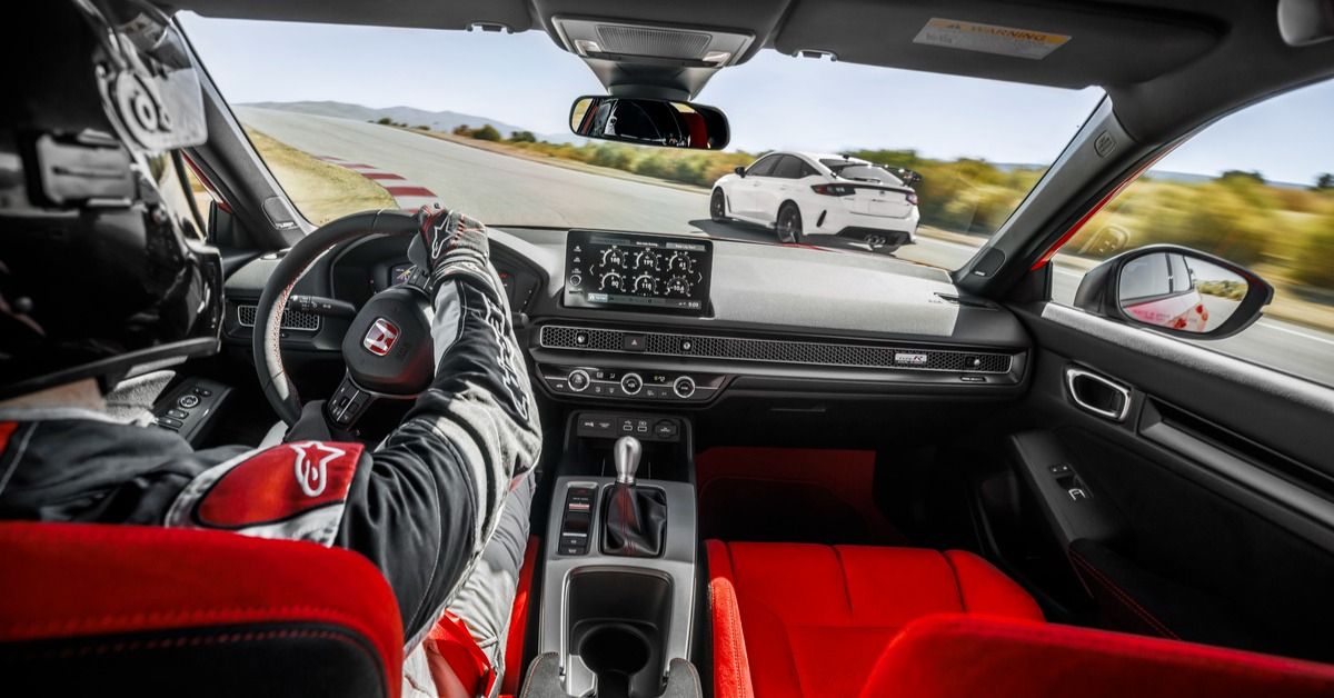 A professional racer inside the 2023 Honda Civic Type R's interior. 