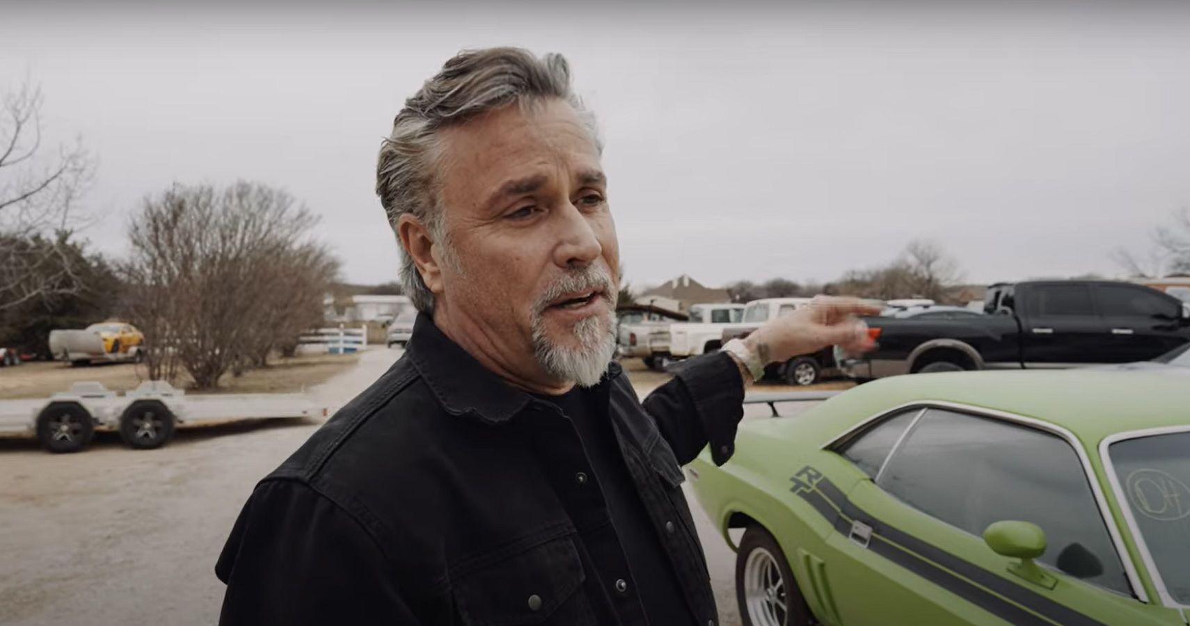 Richard Rawlings Next To A Dodge Challenger RT