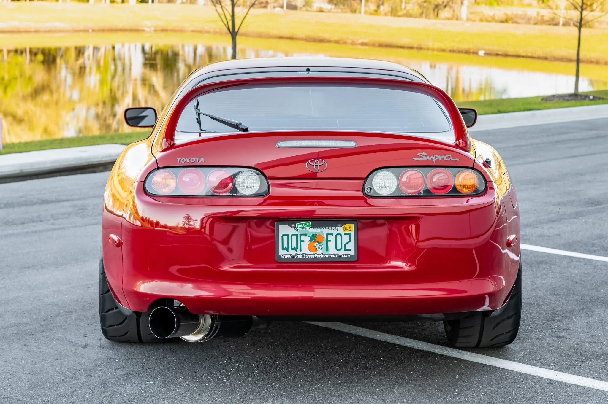 Red 1994 Supra parked