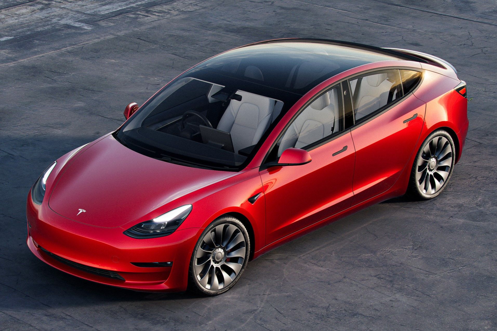 Red 2022 Tesla Model 3 parked outdoor