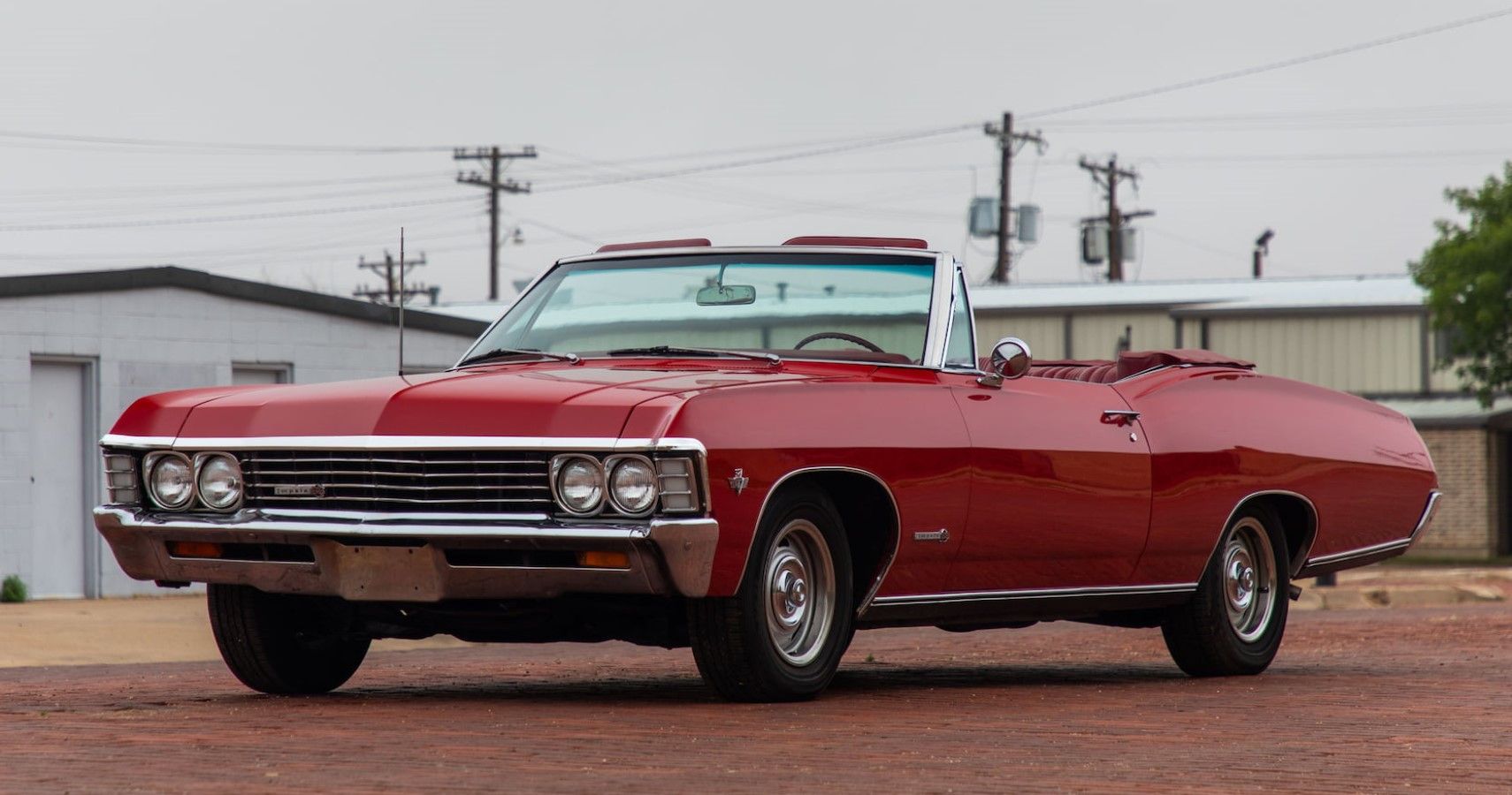 Red 1967 Chevrolet Impala SS Convertible front third quarter cinematic view