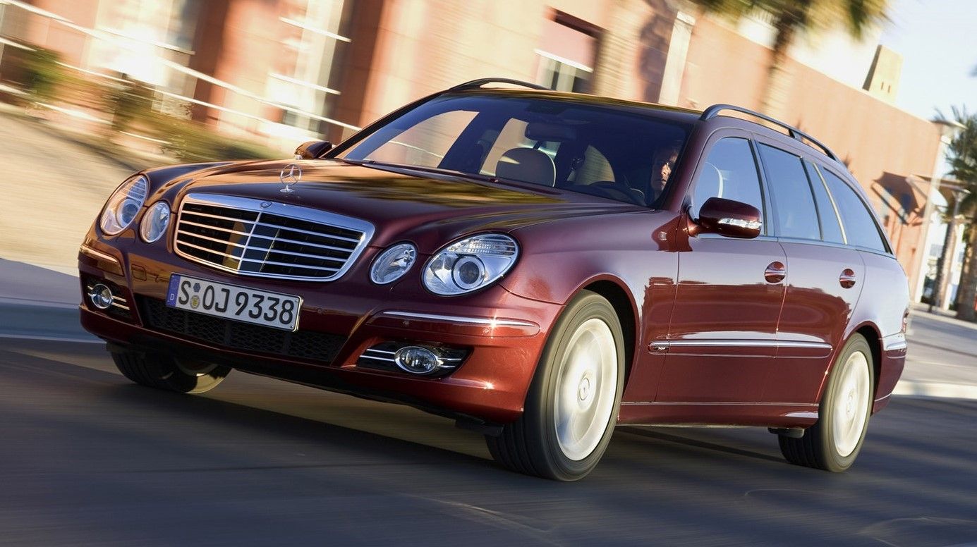 Burgundy 2006 Mercedes-Benz E-Class Wagon driven on the road