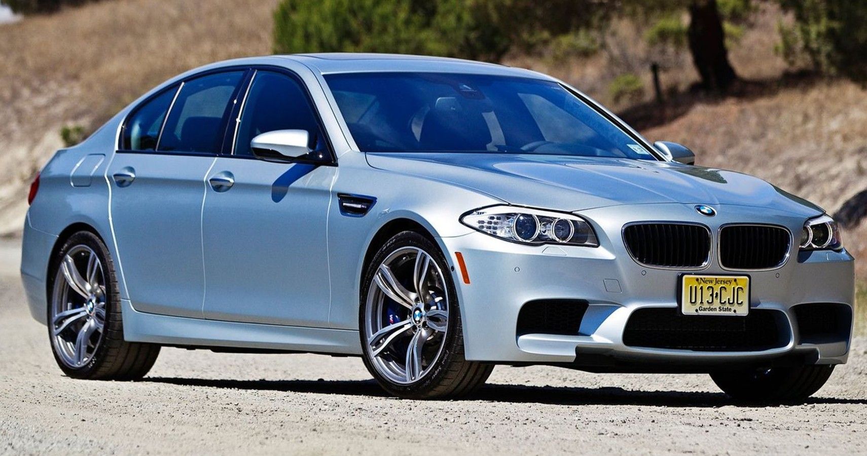 Silver 2013 BMW M5 on the road
