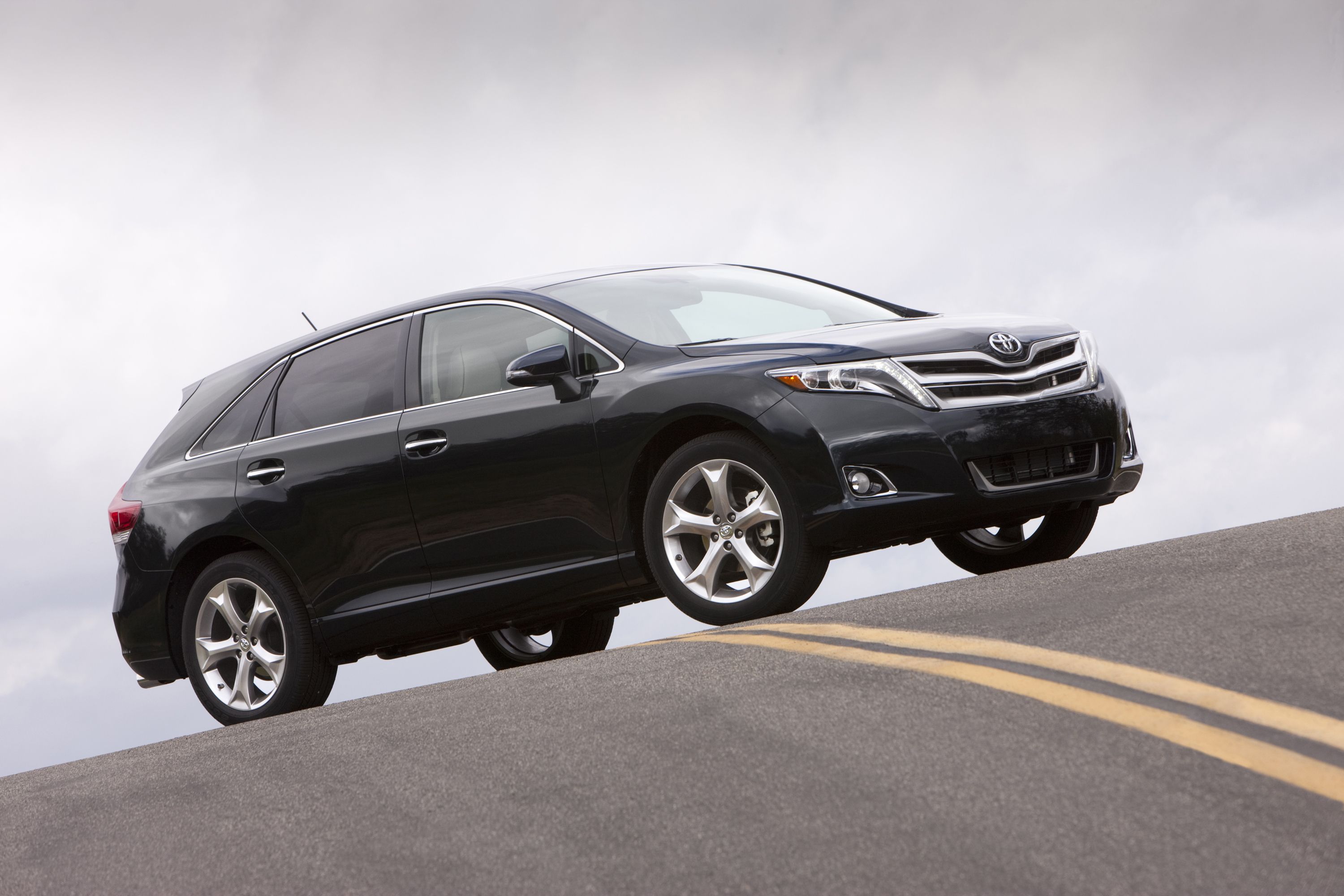 Black 2014 Toyota Venza on the road