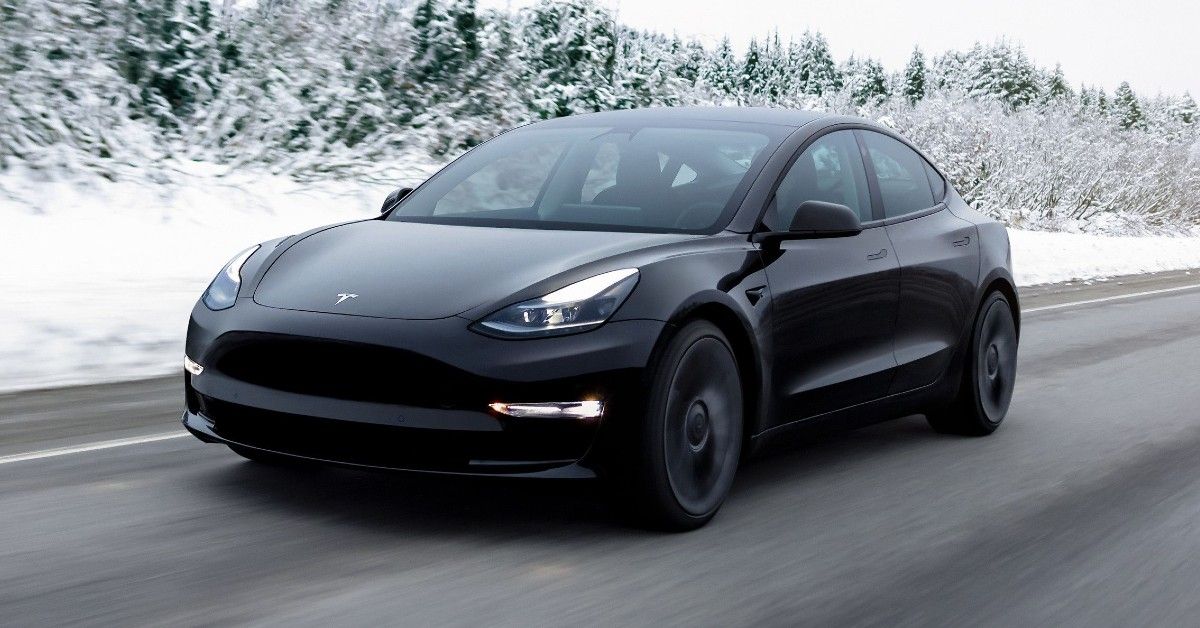 Black 2021 Tesla Model 3 on the road 