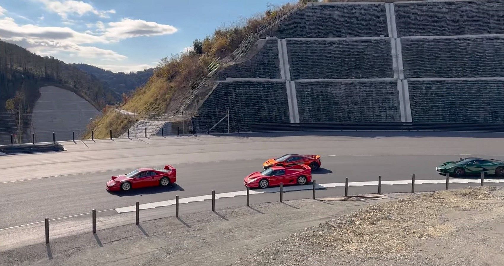 Magarigawa Race Track and supercars, shot of cars on corner of track