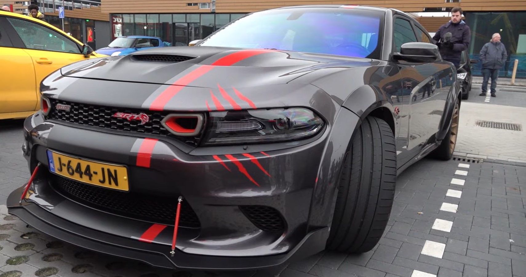 Modified Dodge Charger Hellcat headlight claw mark decal close-up view