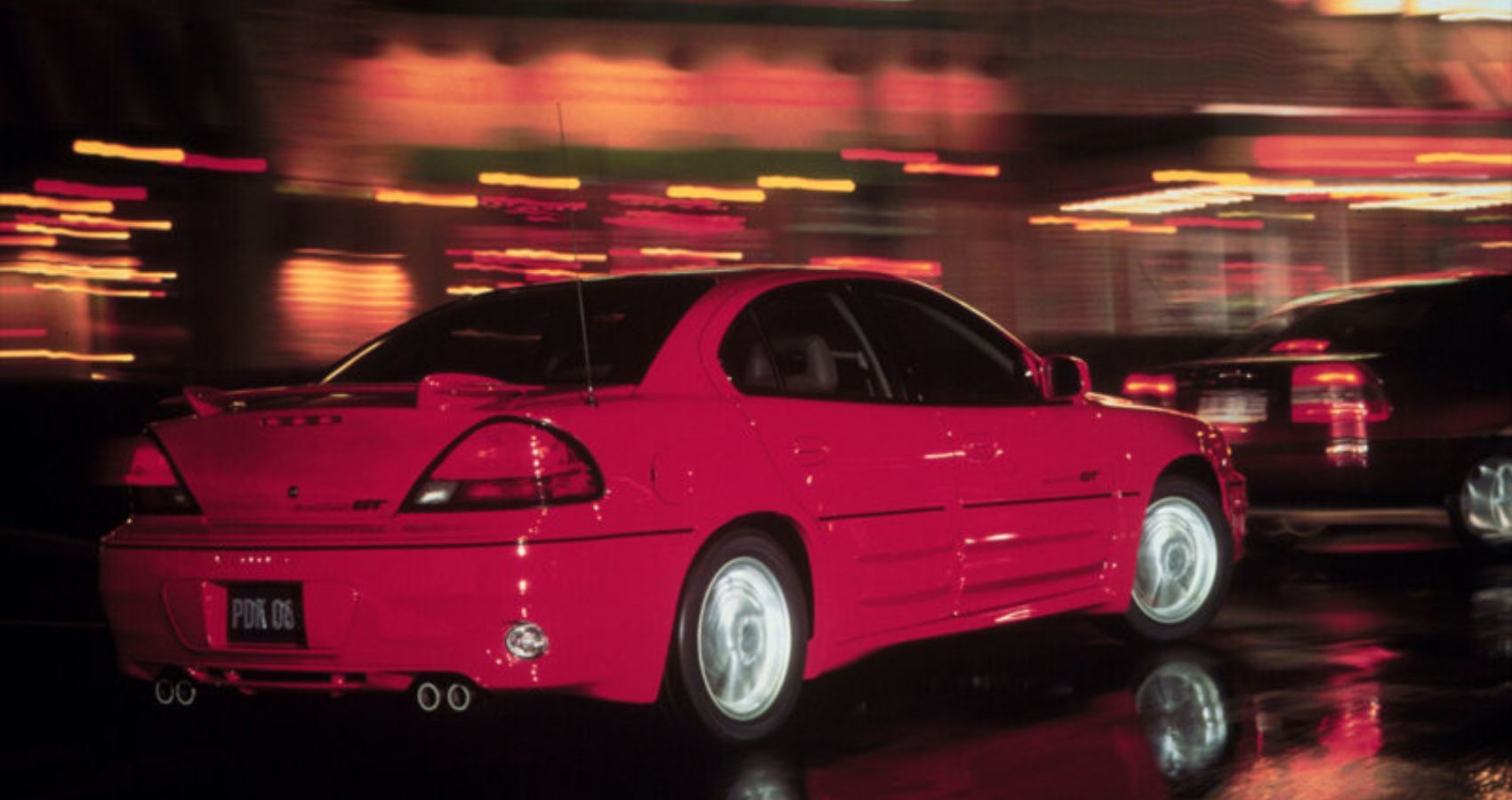 Red 2001 Pontiac Grand Am - rear view 