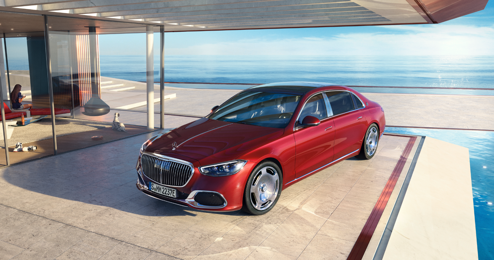 Red Mercedes-Maybach S 580 e parked by a pool
