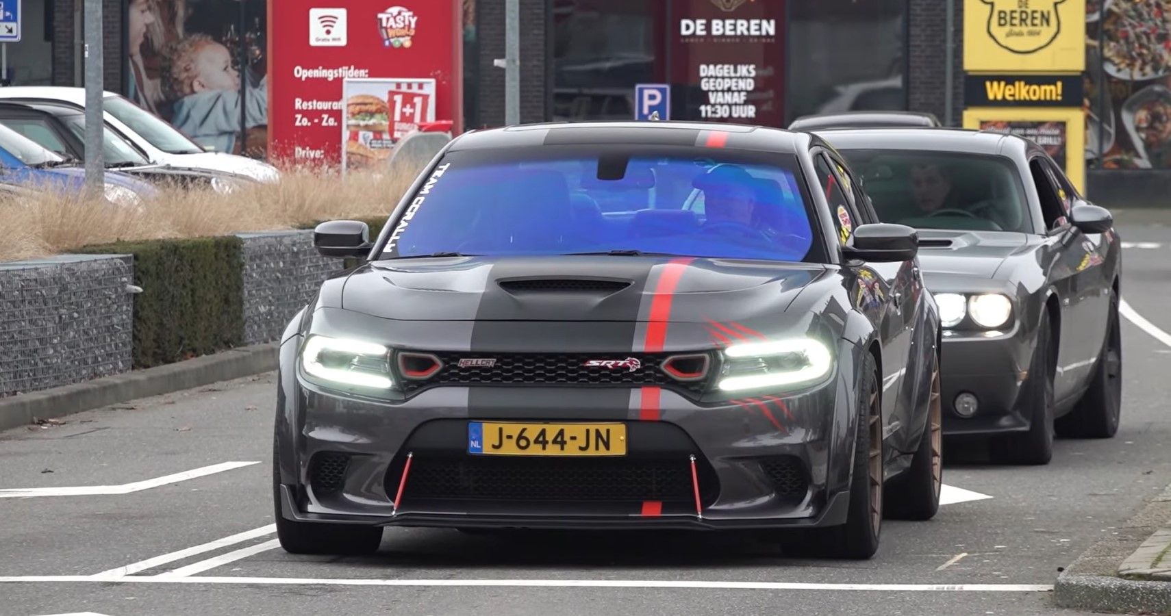Modified Dodge Charger Hellcat from Europe front fascia view at a traffic stop
