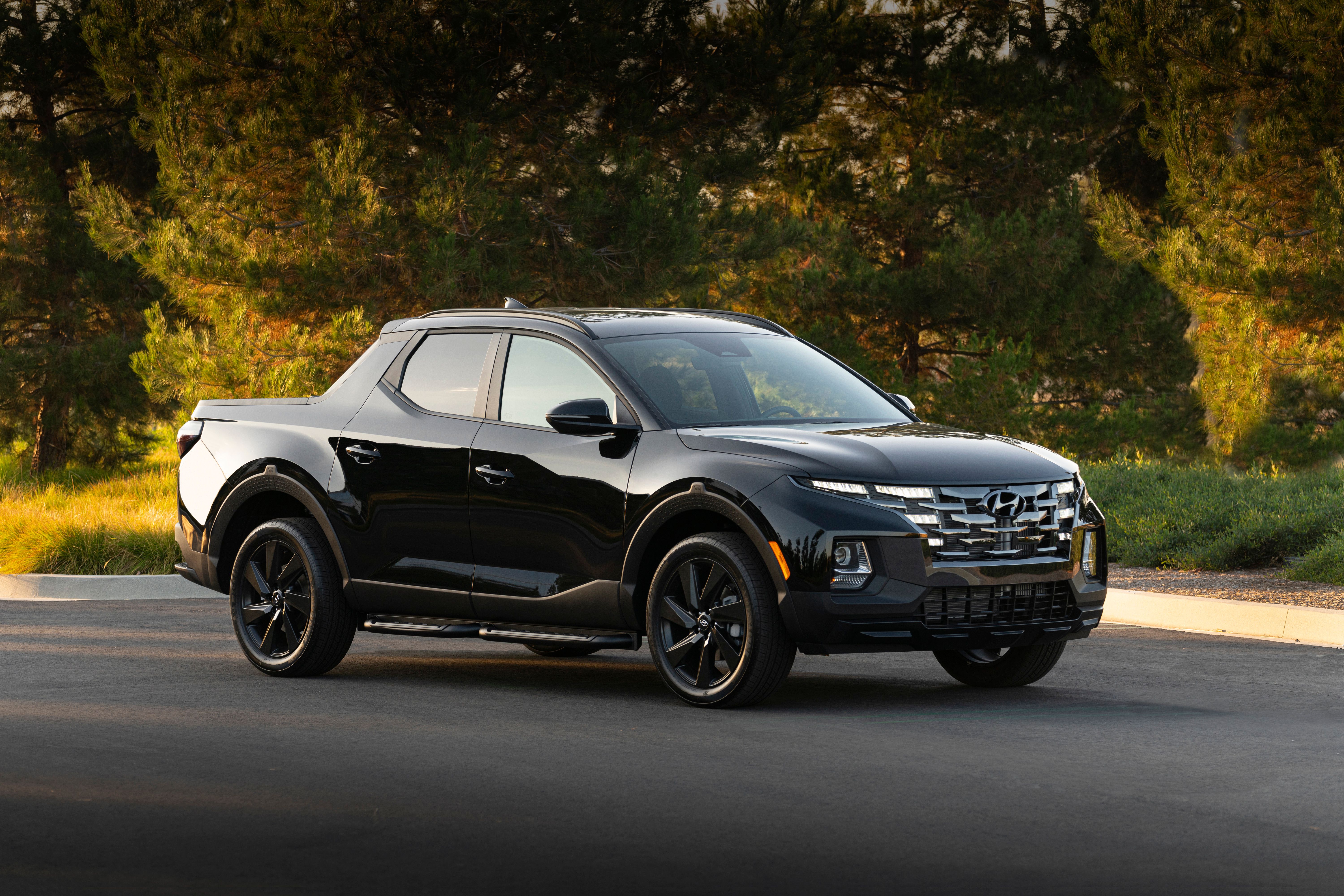 The black 2023 Hyundai Santa Cruz.