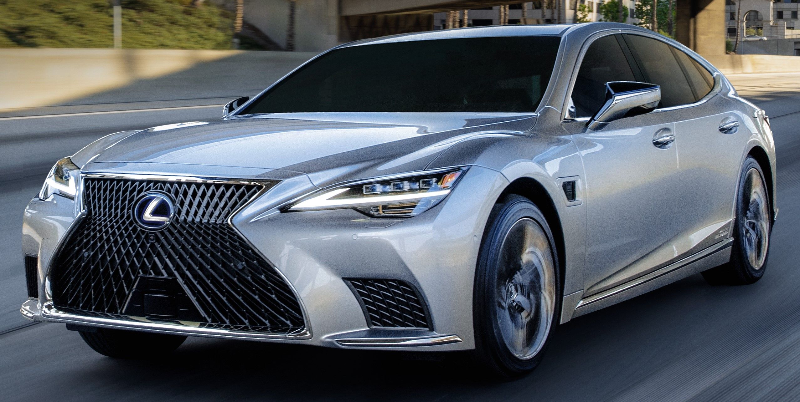 Silver 2023 Lexus LS 500h driven on the road