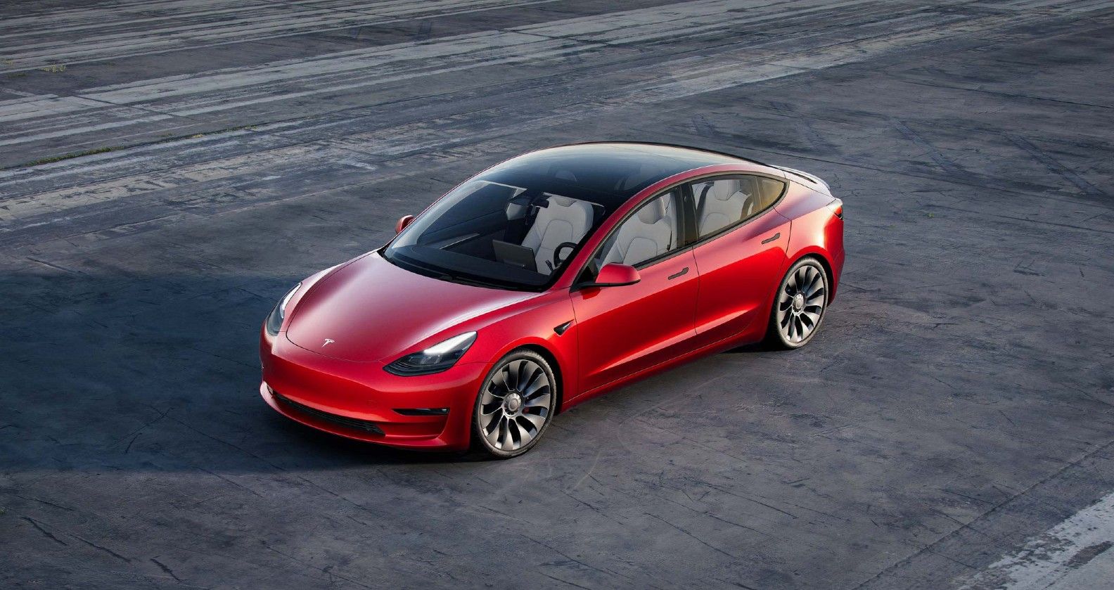 red Tesla Model 3 from above 