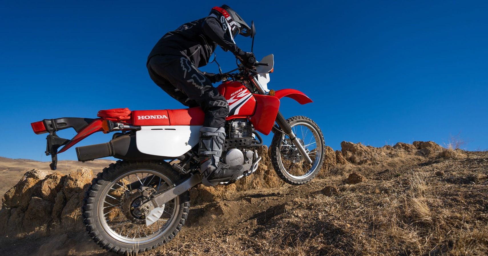 Red XR650L riding on dirt