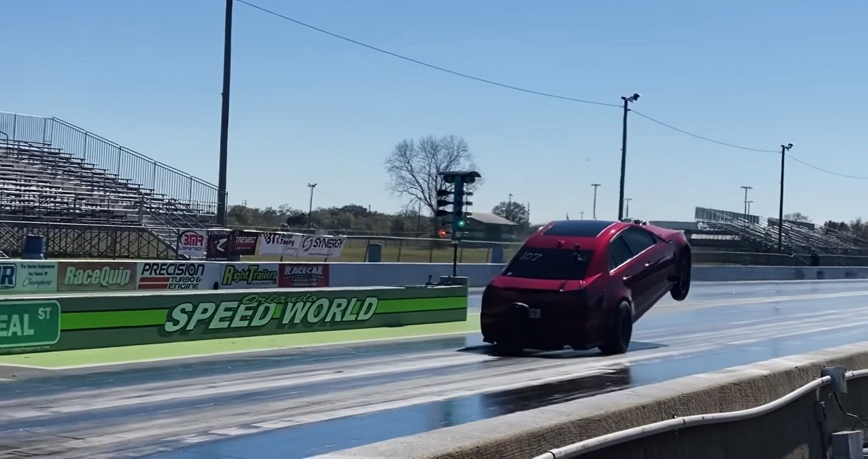 Mikhael Morris Cadillac CTS-V Drag racer wheelie, view from distance on track