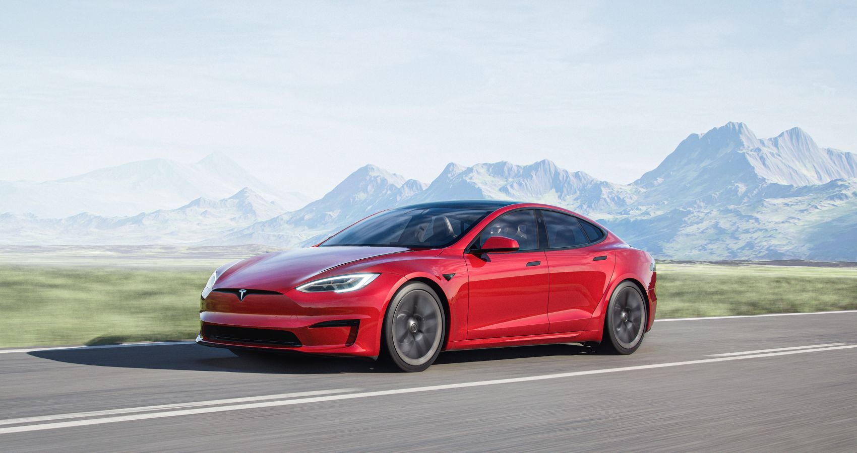 Tesla Model S in red front third quarter accelerating view