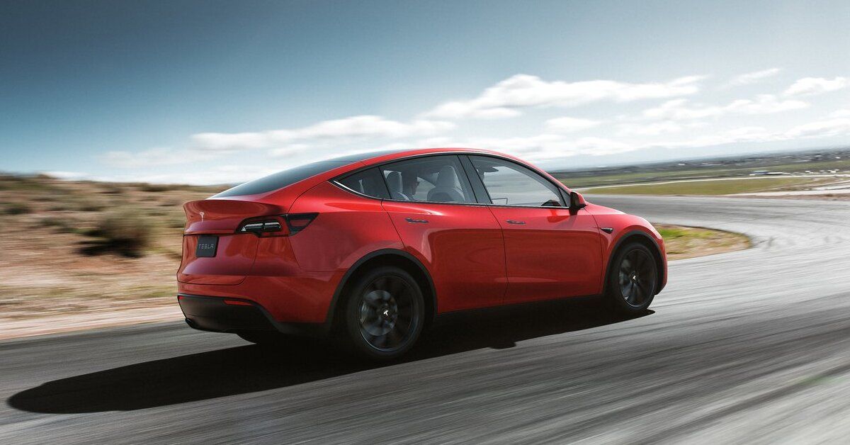 Tesla Model Y rear third quarter accelerating view