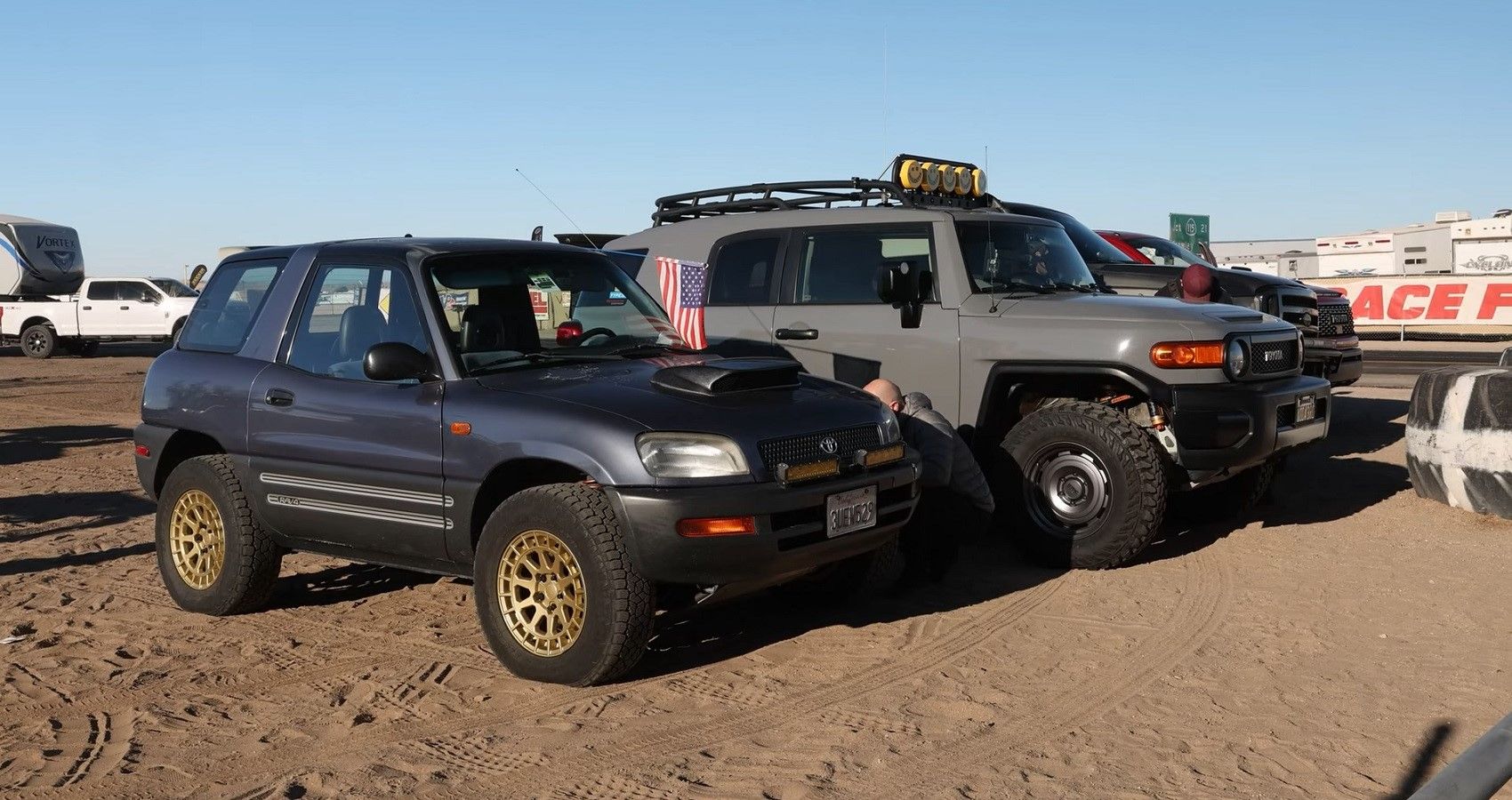 Toyota RAV4 and Toyota FJ Cruiser front quarter view of both, side by side