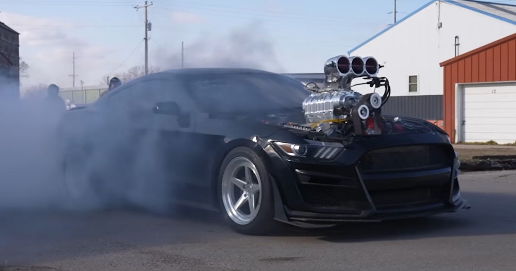 Westen Champlin's 2000-HP Ford Mustang doing burnouts front third quarter view