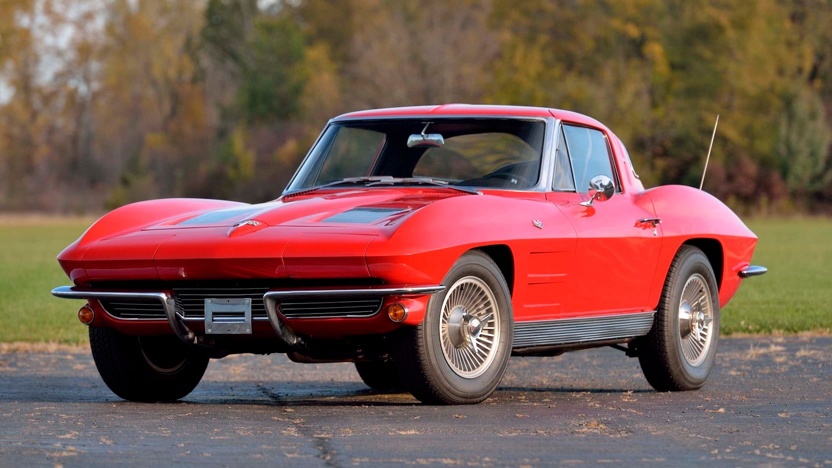 Red 1963 Chevrolet Corvette Sting Ray on the road