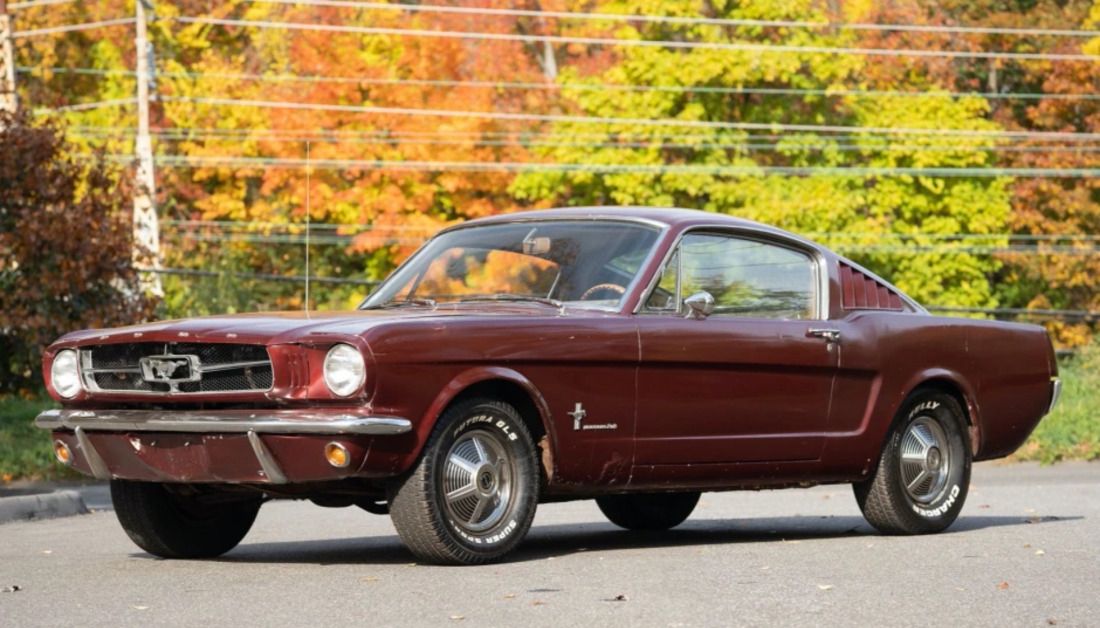 Burgundy Ford Mustang Fastback muscle car parked