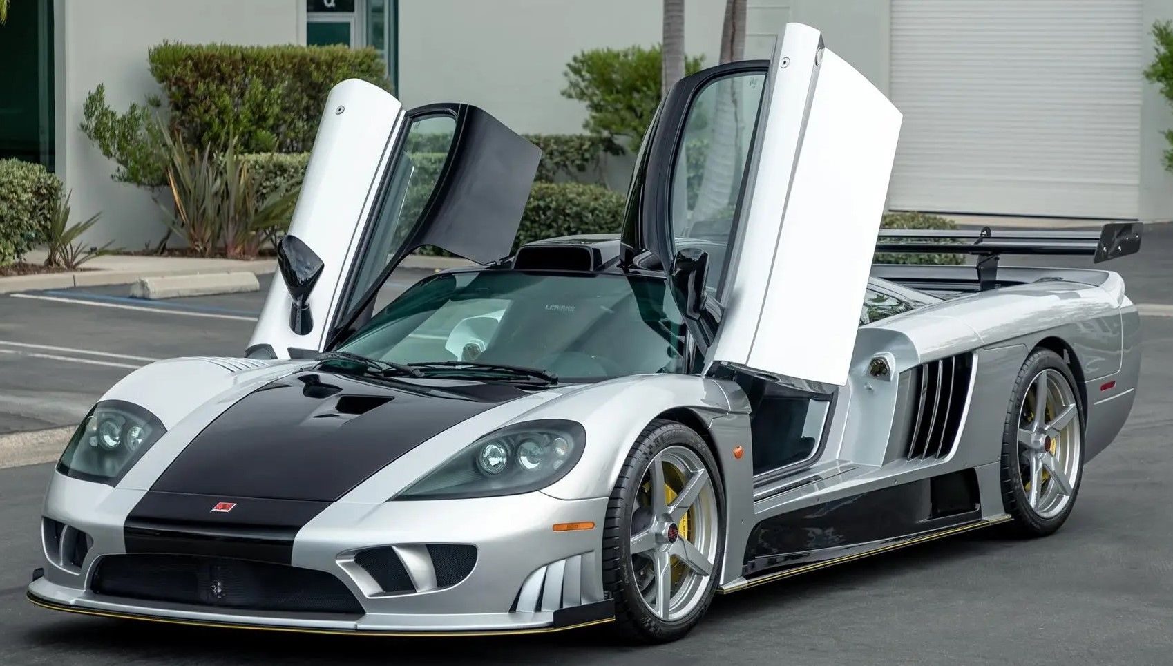 Gray 2007 Saleen S7 parked outdoors with its doors open