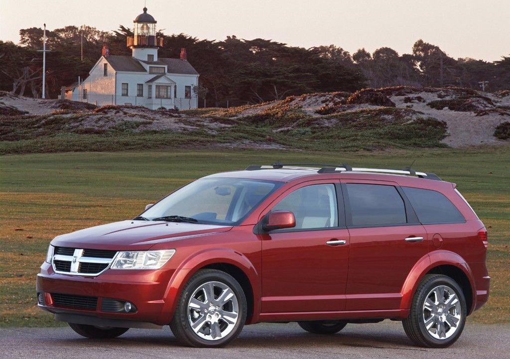 Red 2009 Dodge Journey on the road