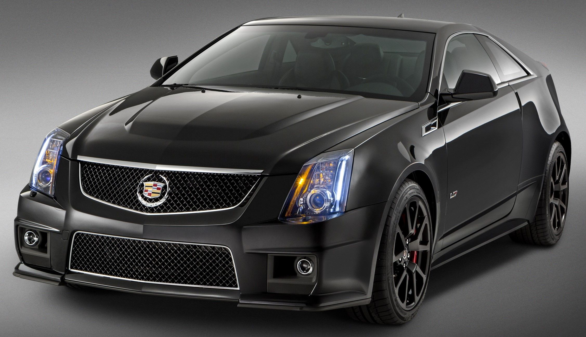 Black 2015 Cadillac CTS-V Coupe parked indoors under studio lighting