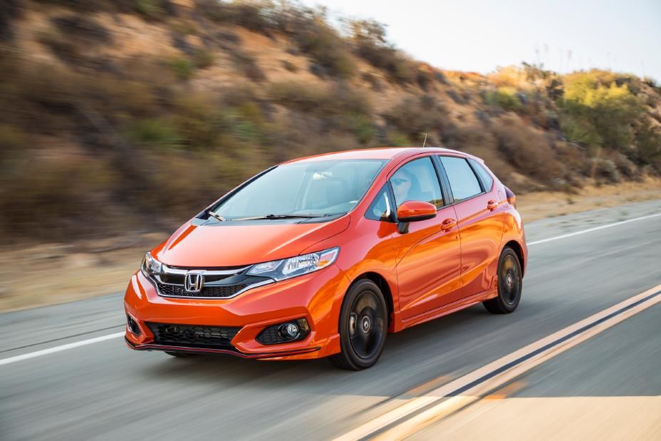 Red 2017 Honda Fit on the road