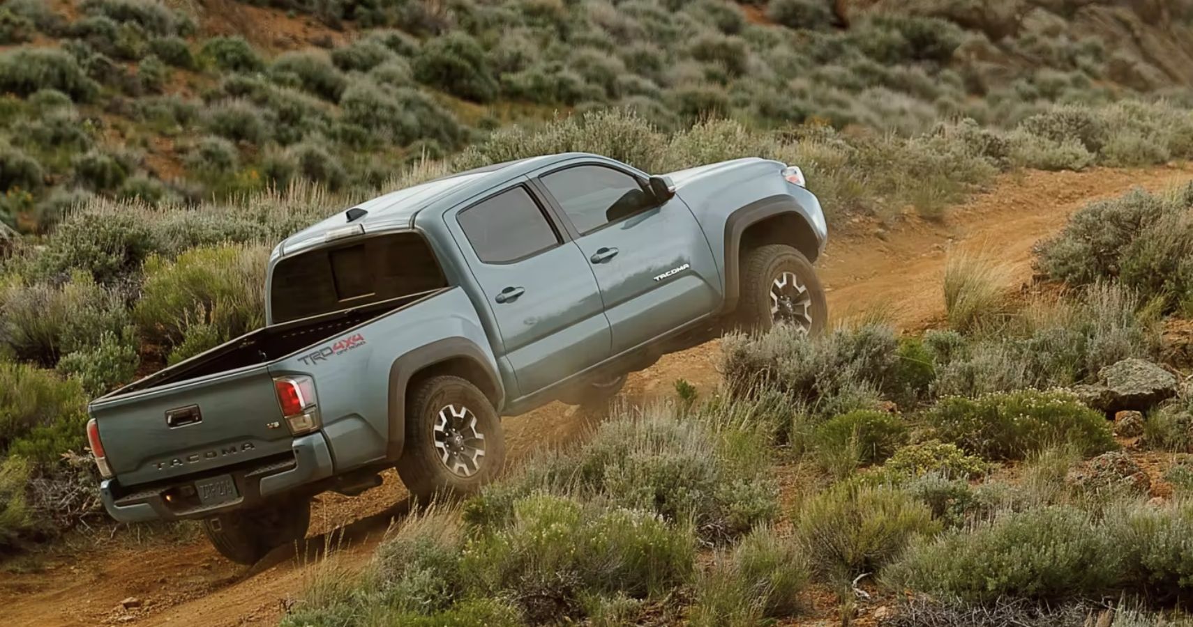 2023-toyota-tacoma-double-cab-driving-exteior-rear-view