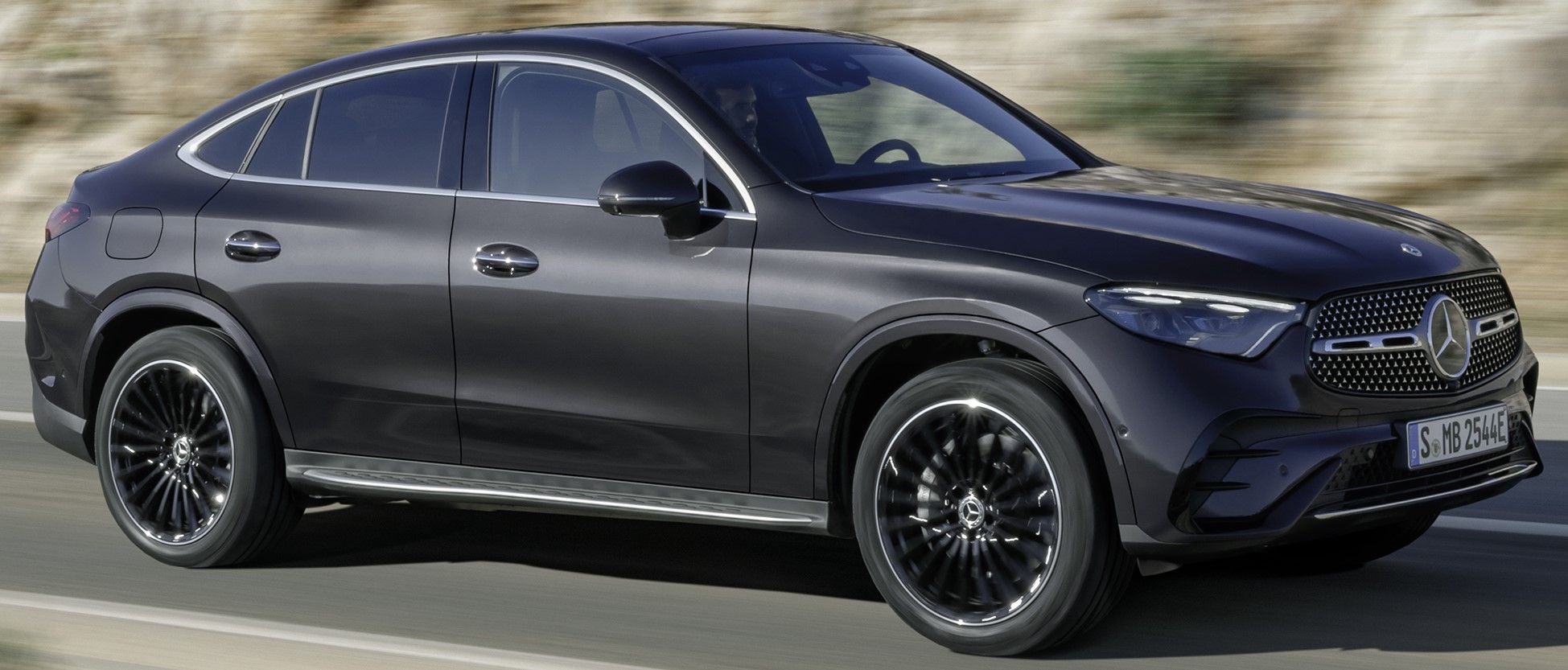 Black 2024 Mercedes-Benz GLC Coupe driven on the road