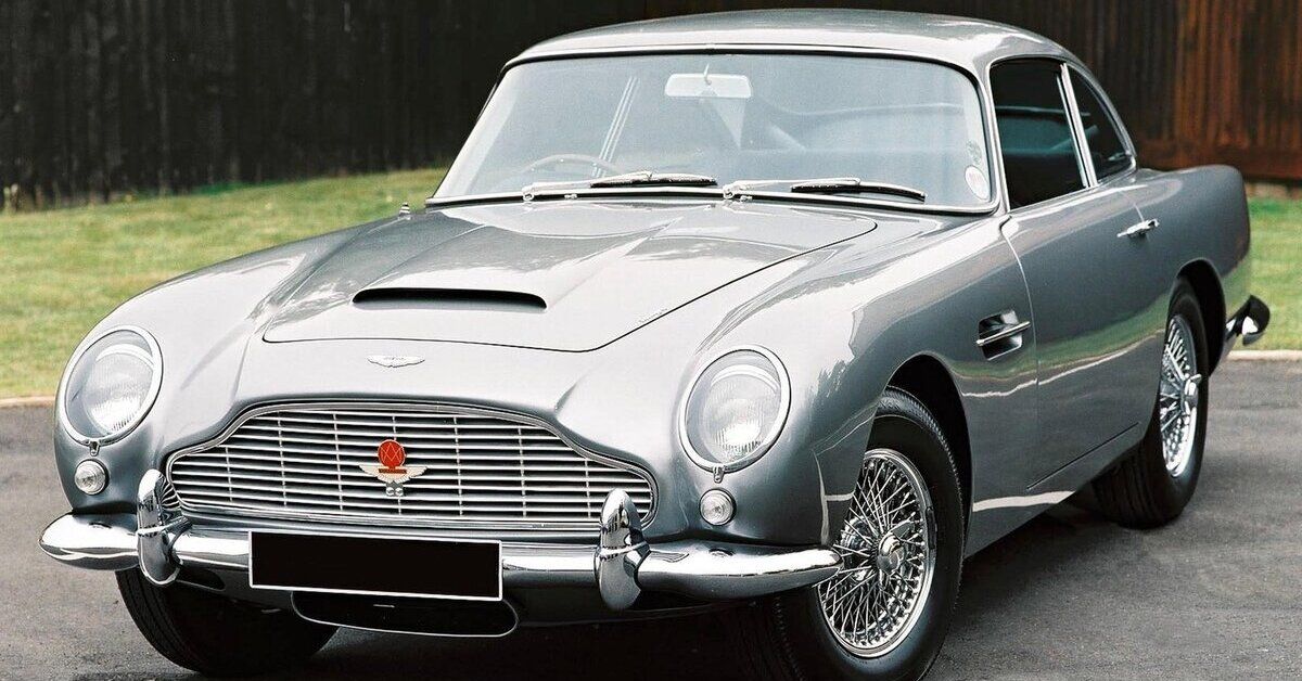 A silver 1963 Aston Martin DB5 parked