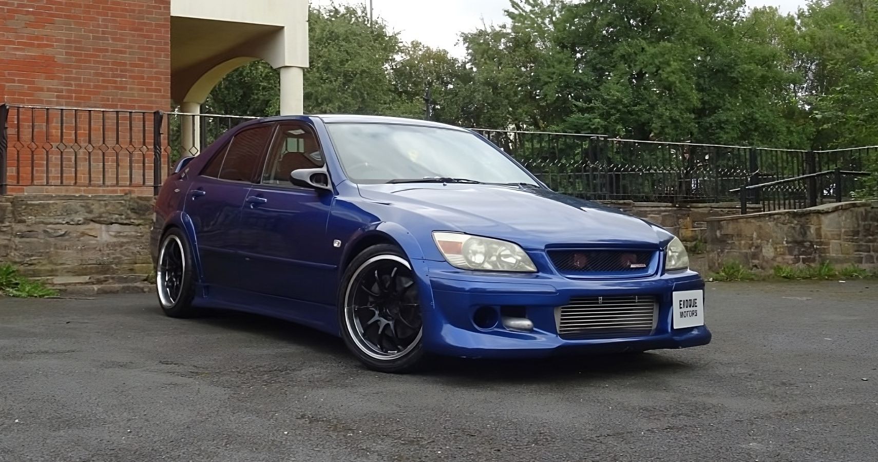 A blue Toyota Altezza RS200 parked