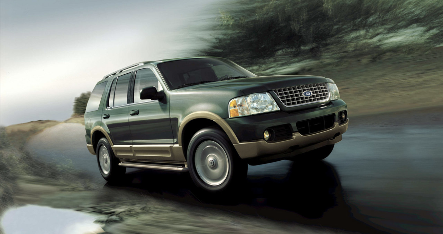 Green 2002 Ford Explorer on the road