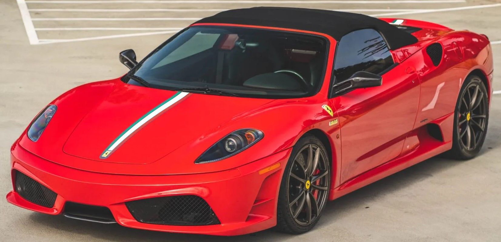 Red Ferrari F430 parked outdoors 