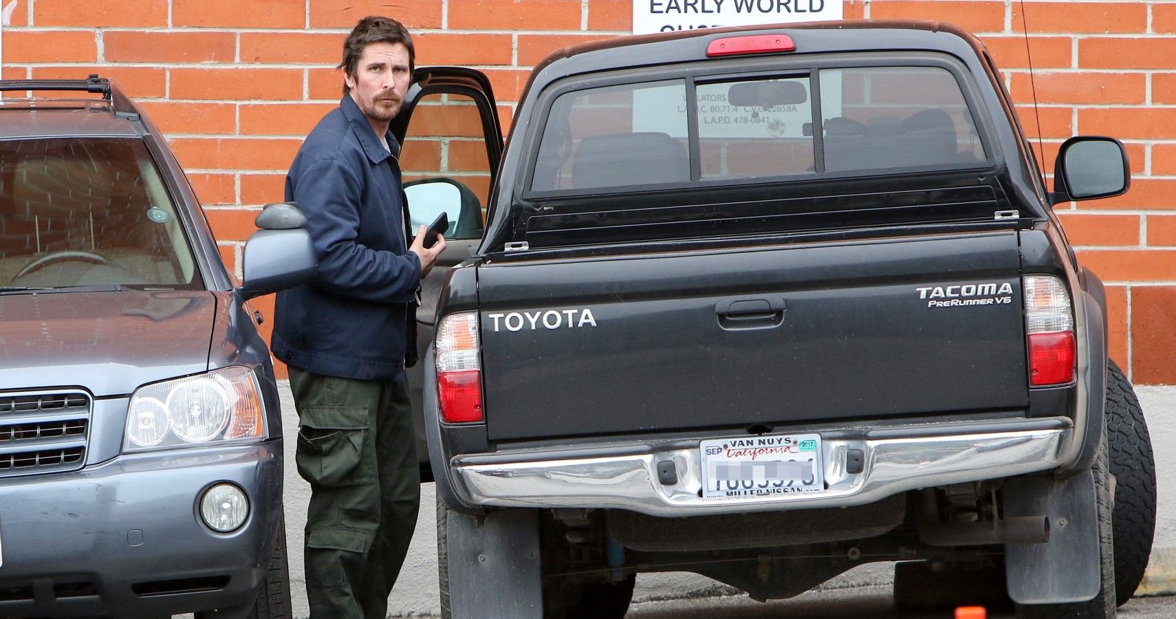 Christian Bale with his 2003 Toyota Tacoma pickup truck rear view