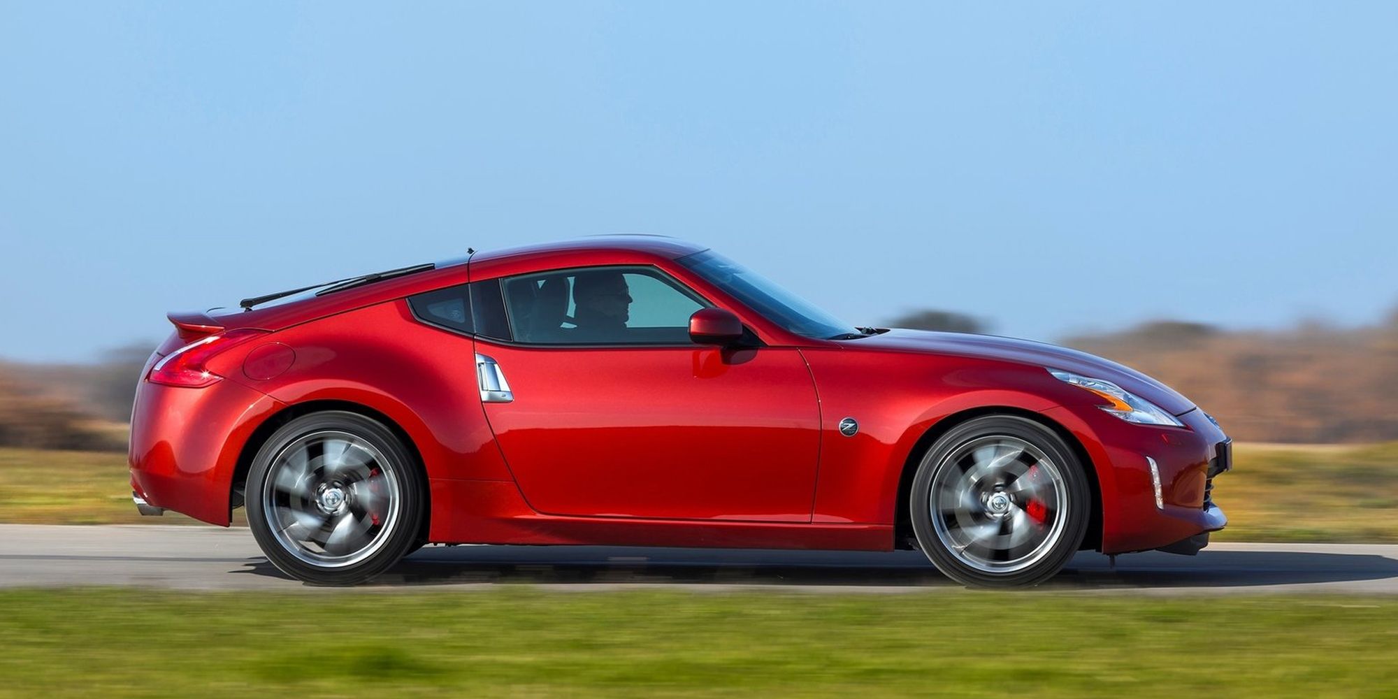 Nissan 370Z Side Profile Magma Red Driving