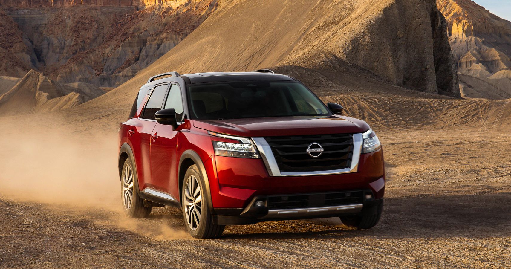 Red 2023 Nissan Pathfinder SUV in the desert