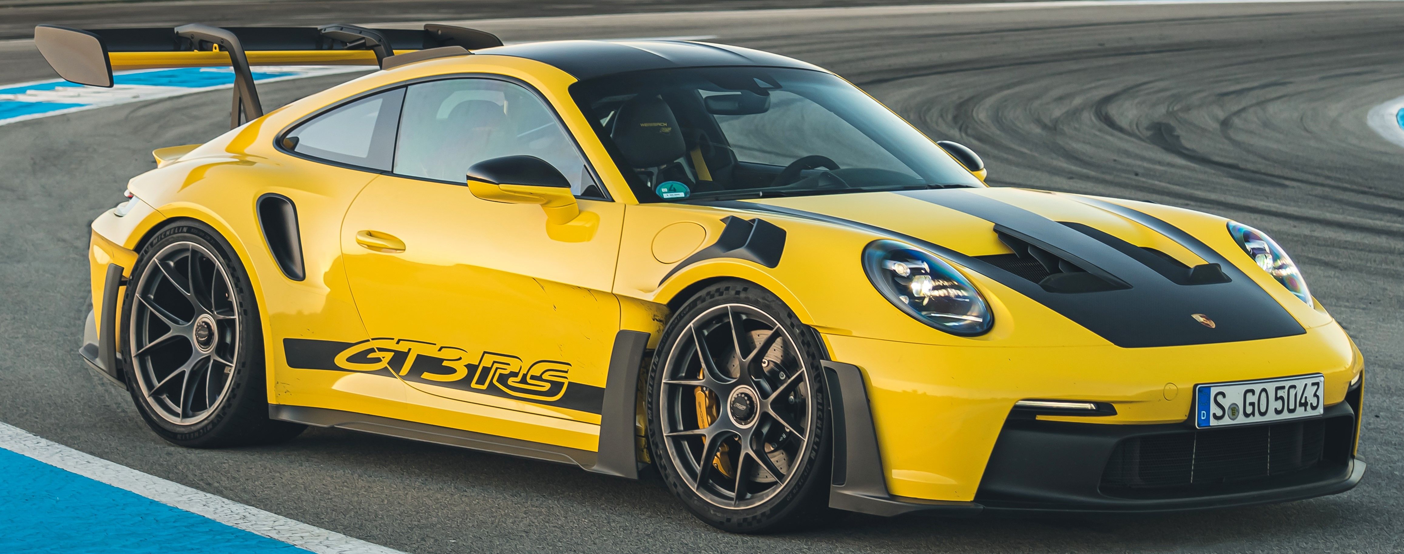 Yellow 911 GT3 RS parked on the trackside