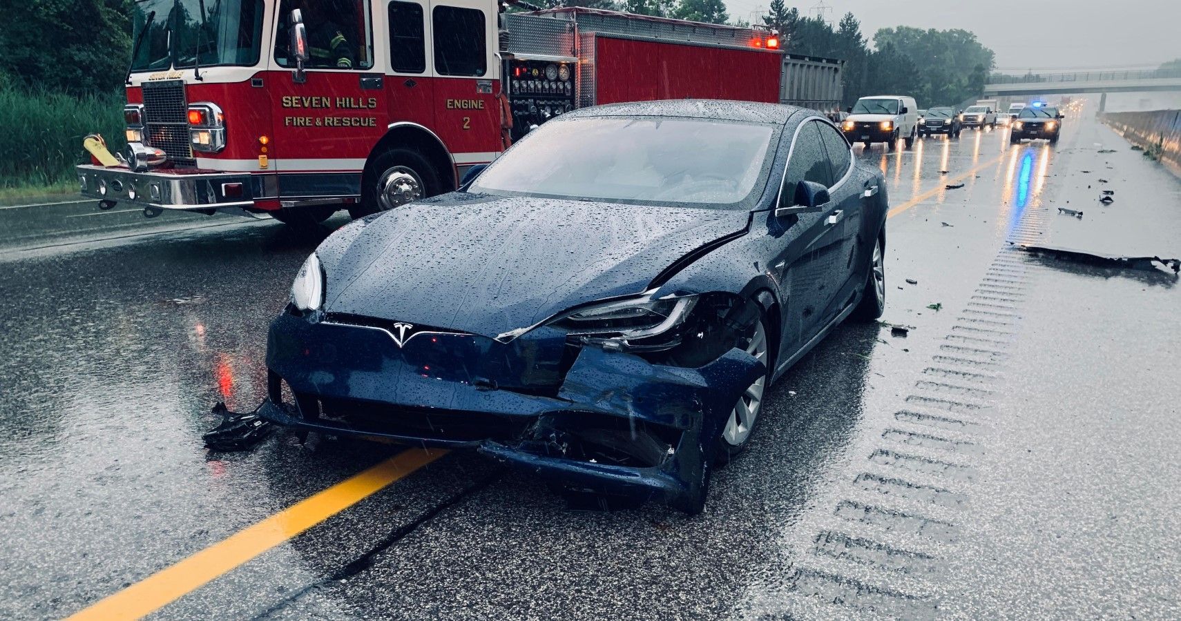 Tesla Model S accident on the highway front third quarter aftermath view