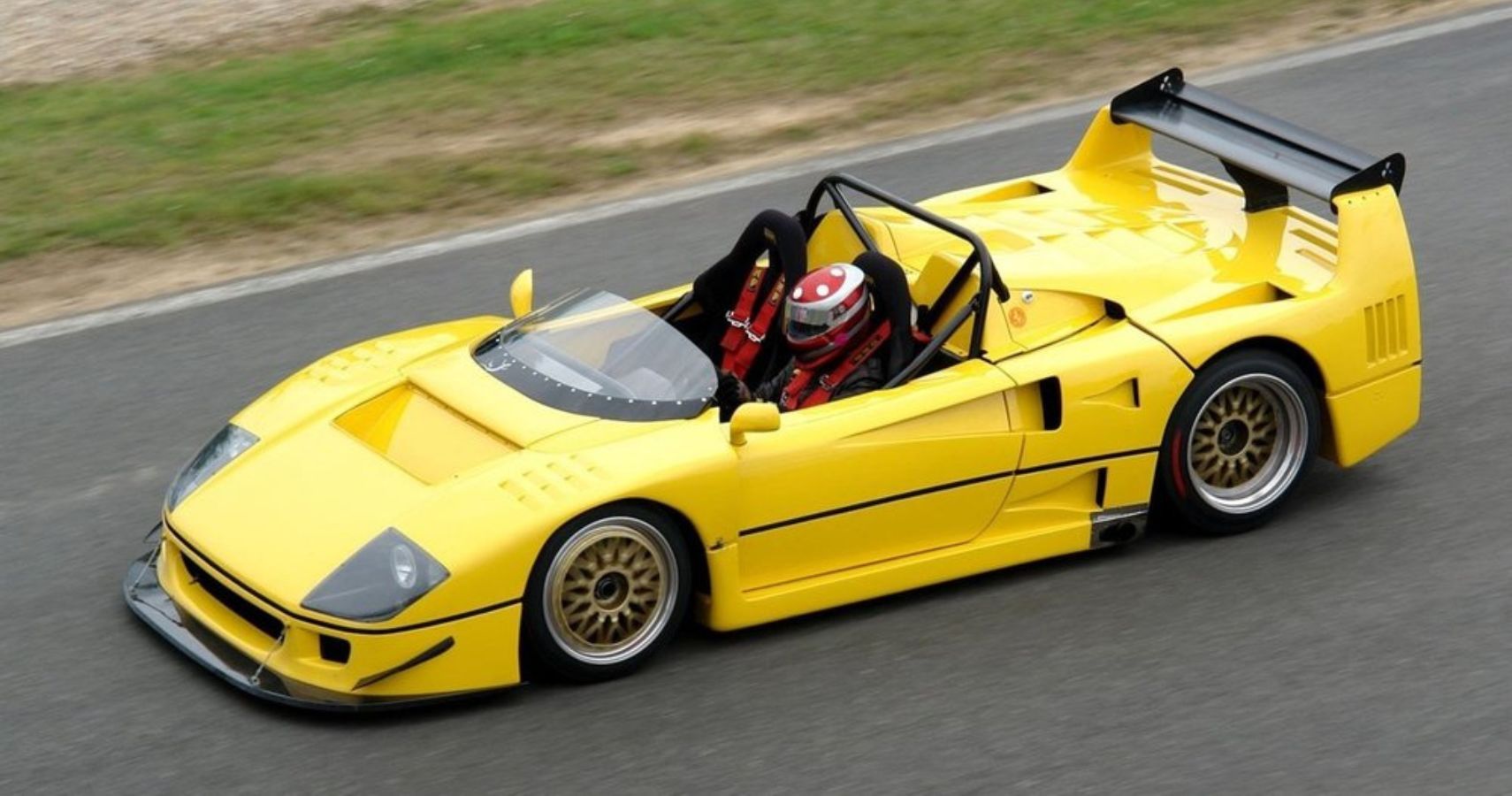 Yellow Ferrari F40 Barchetta Driving on Track