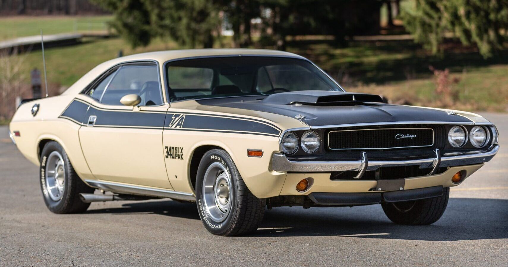 A cream 1970 Dodge Challenger T/A 340 Six Pack parked