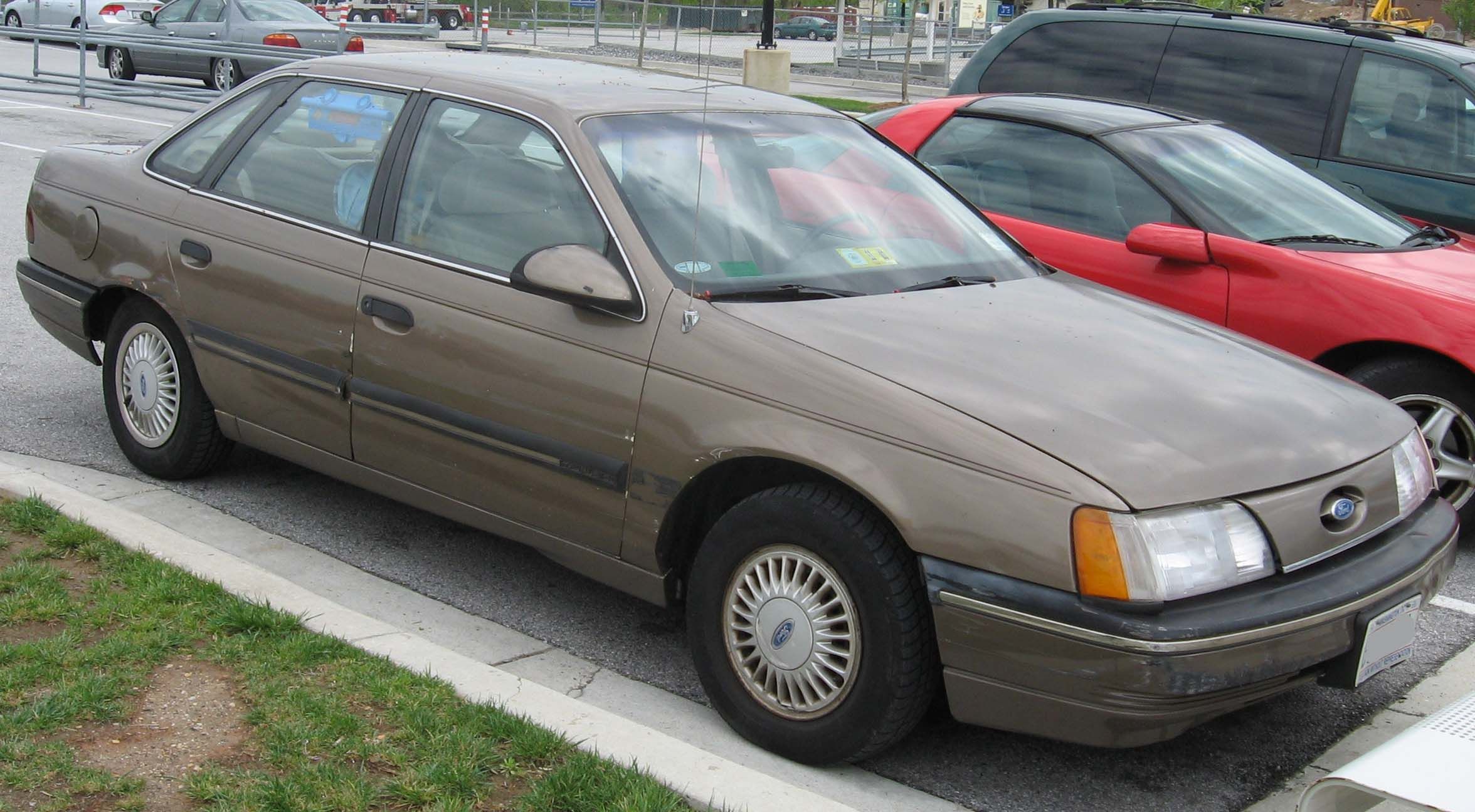 Brown 1986-88 Ford Taurus parked